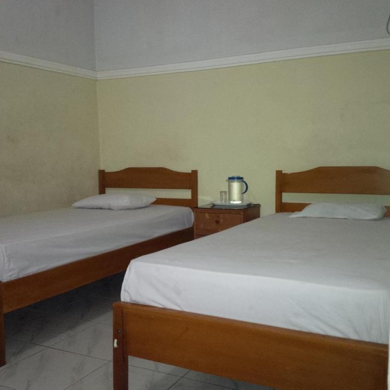 Hotel Bahagia Пангкалан Бун Номер фото